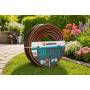 Gardena 30 m Flex garden hose 13 mm coiled on lawn with flowers in background