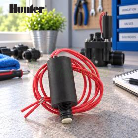 24V solenoid with red leads for irrigation valve on workshop bench